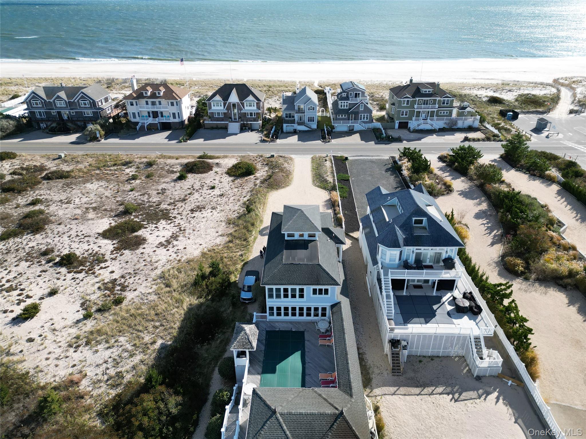 750 Dune Road West Hampton Dunes, NY 11978 - Photo 3 of 49 Aerial perspective of suburban area with unending shoreline