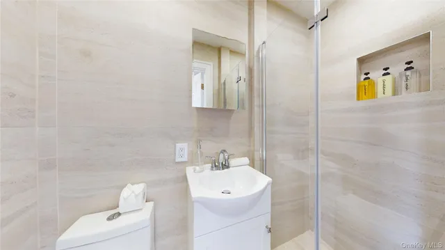 a large white bed in a white room