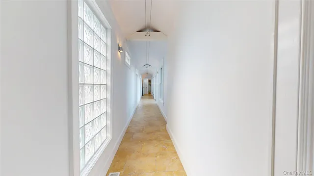 a view of a house with wooden floor and a yard