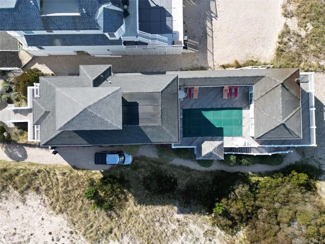 a view of a swimming pool with outdoor seating