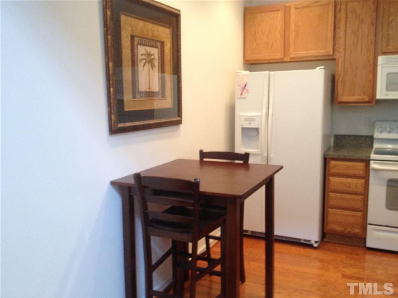8514 Micollet Court Raleigh, NC 27613 - Photo 3 of 9 a room with a table and a window
