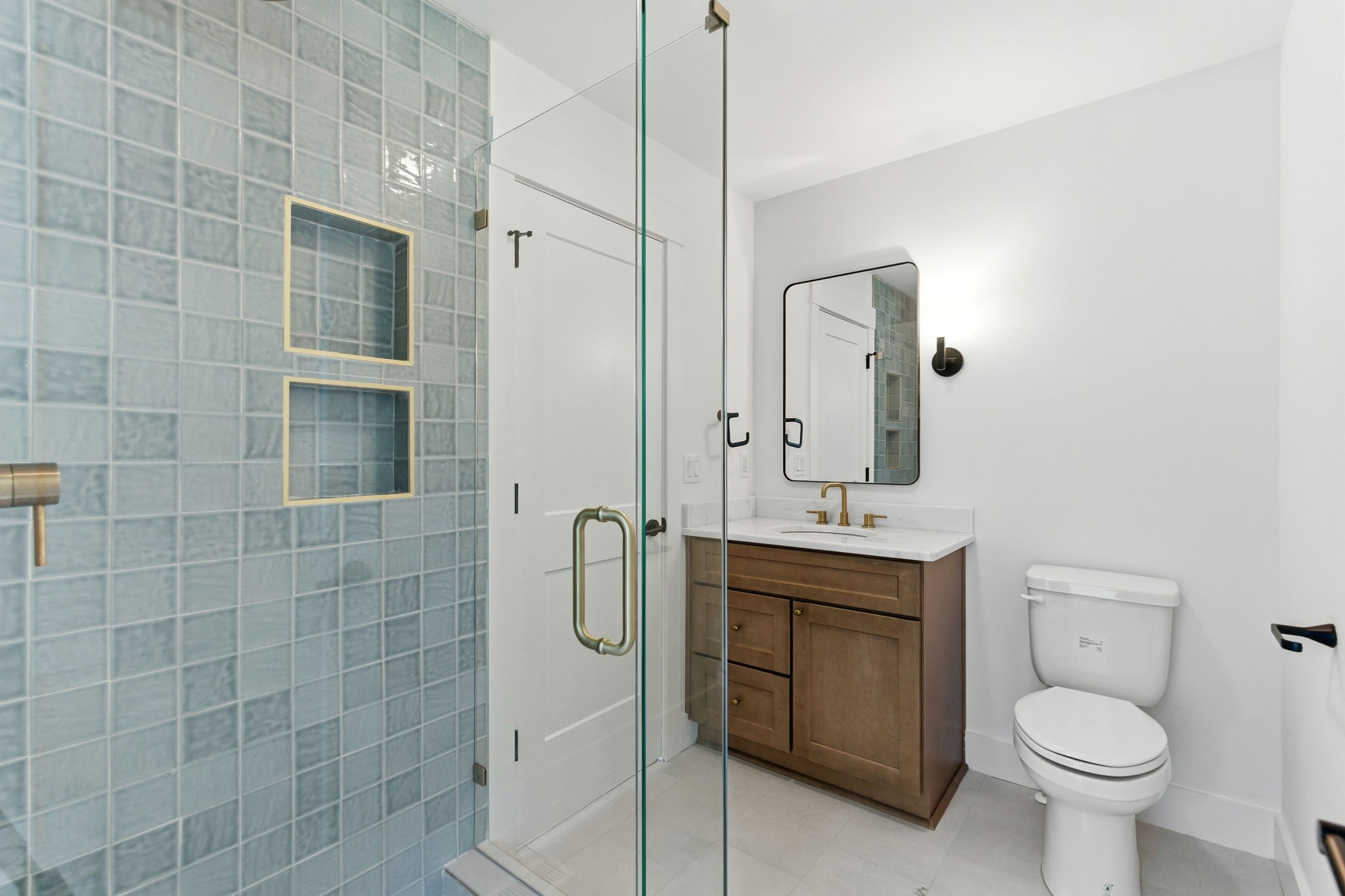 1020 West Kirkland Avenue, Unit C Nashville, TN 37216 - Photo 11 of 23 a bathroom with a sink a toilet and mirror