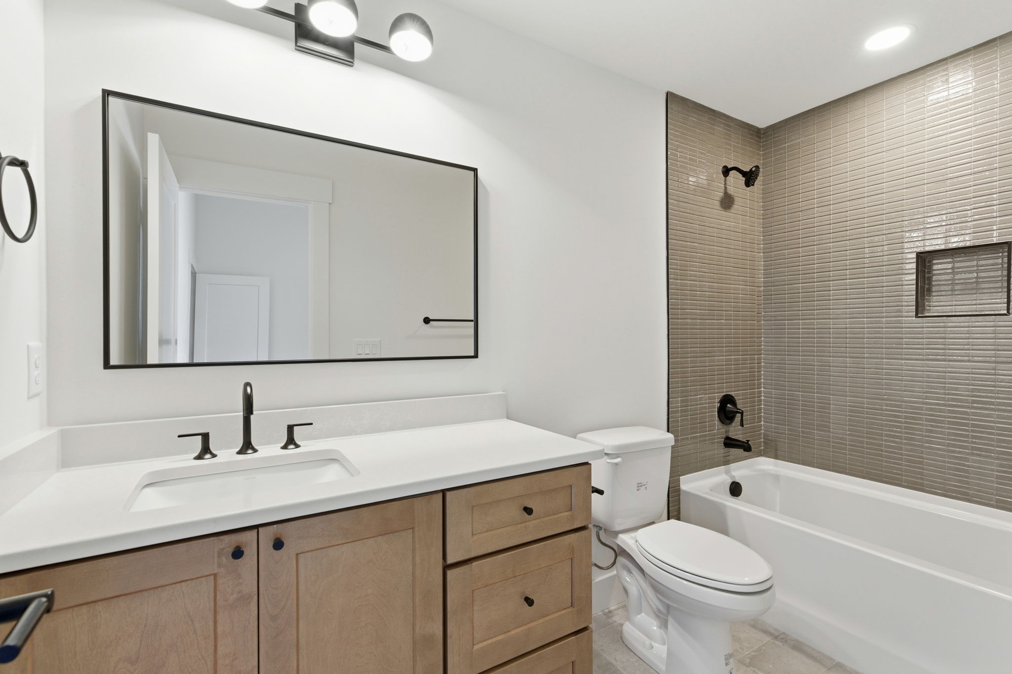 1020 West Kirkland Avenue, Unit C Nashville, TN 37216 - Photo 14 of 23 a bathroom with a toilet a sink a mirror a bathtub and vanity