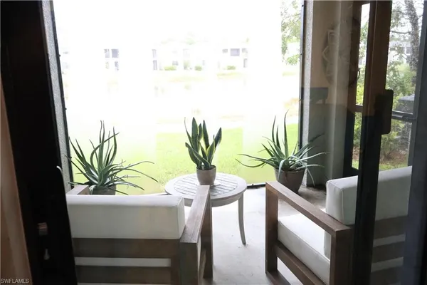 a view of balcony with a potted plant