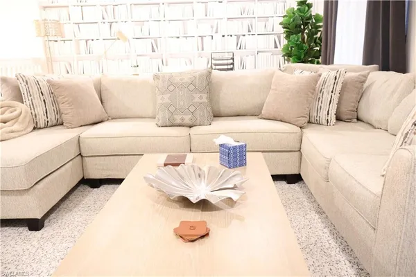 a living room with furniture and a couch