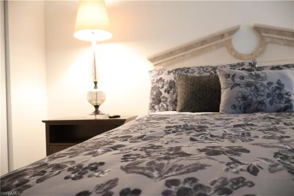 a bed sitting in a bedroom with a bed