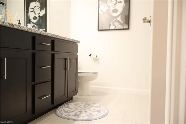 a bathroom with a toilet and a sink