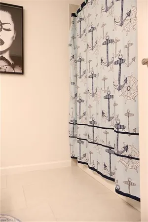 a living room with a window and furniture