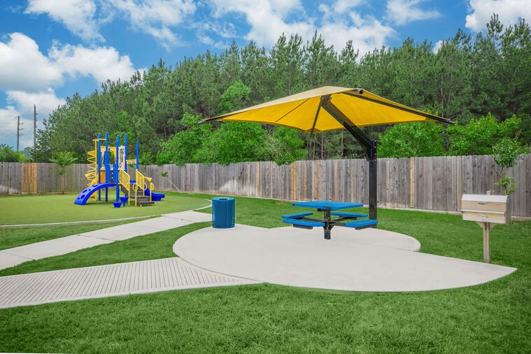 9393 Fm 1960 Bypass Road West, Unit 411 Humble, TX 77338 - Photo 28 of 28 a garden view with a seating space