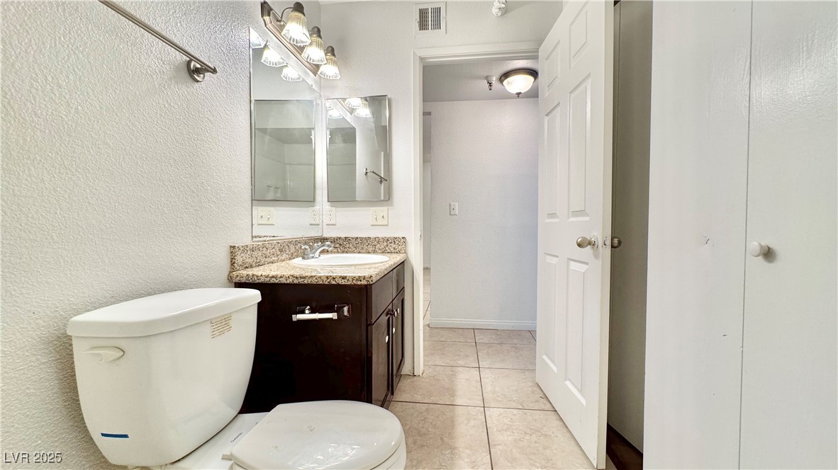 2750 South Durango Drive, Unit 2100 Las Vegas, NV 89117 - Photo 22 of 30 Bathroom featuring vanity and tile patterned floors