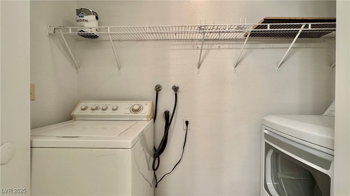 2750 South Durango Drive, Unit 2100 Las Vegas, NV 89117 - Photo 23 of 30 Laundry area with washing machine and clothes dryer