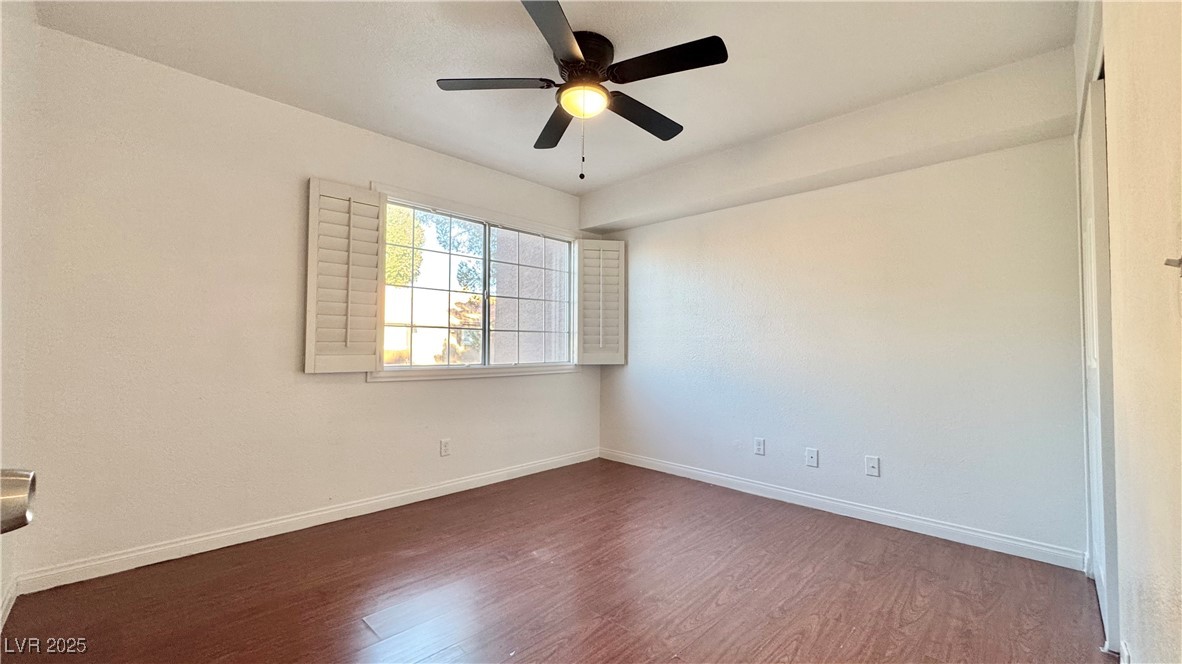 2750 South Durango Drive, Unit 2100 Las Vegas, NV 89117 - Photo 24 of 30 Spare room featuring wood finished floors and ceiling fan