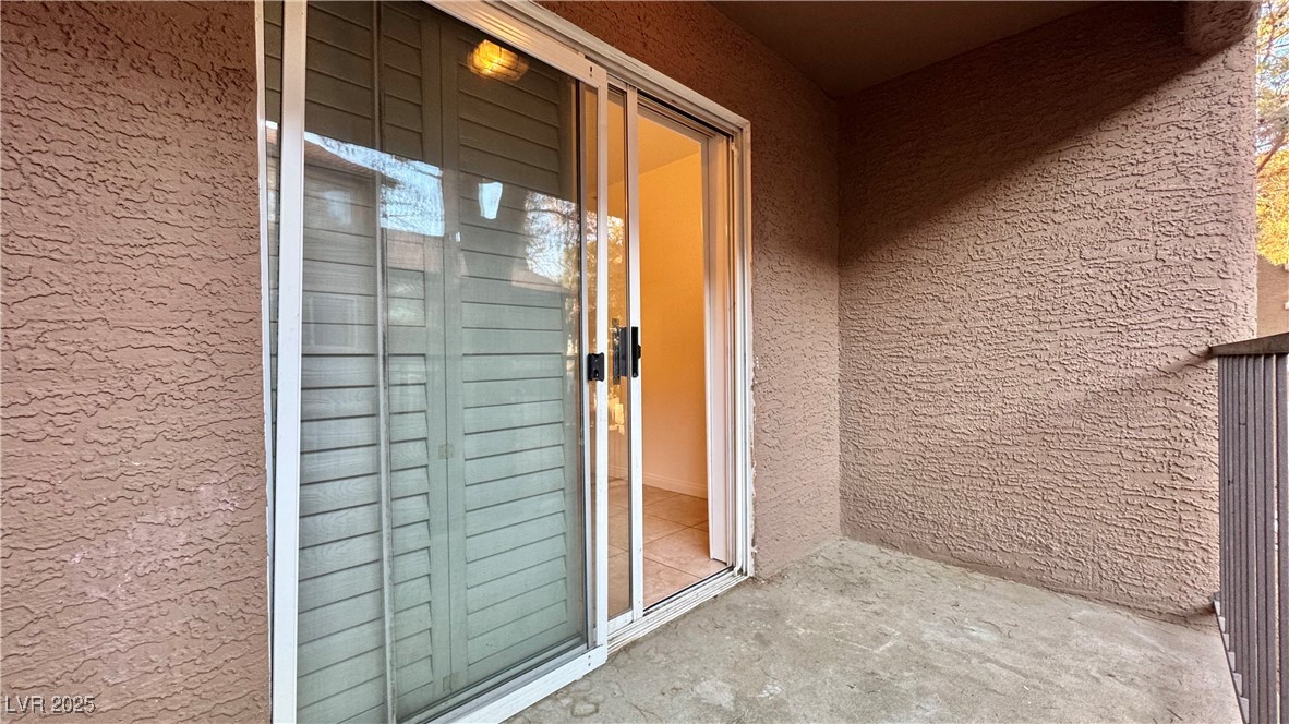2750 South Durango Drive, Unit 2100 Las Vegas, NV 89117 - Photo 28 of 30 Property entrance featuring stucco siding