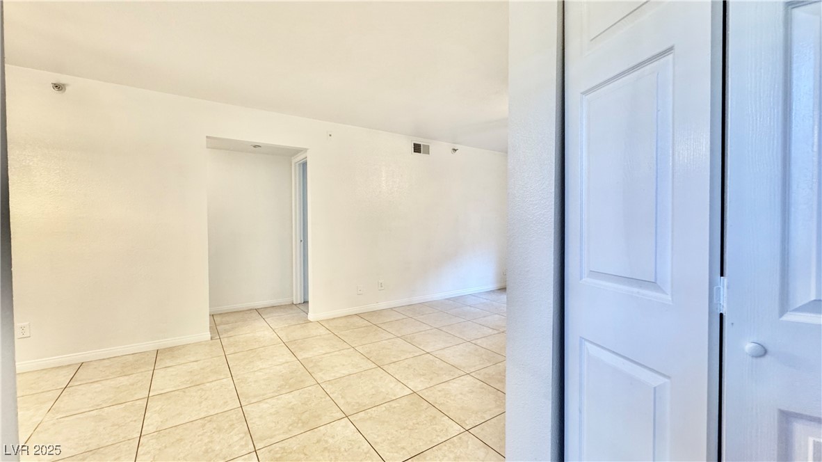 2750 South Durango Drive, Unit 2100 Las Vegas, NV 89117 - Photo 3 of 30 Unfurnished room featuring light tile patterned flooring and baseboards