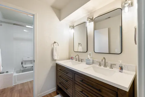 an aerial view of lake and residential houses with outdoor space
