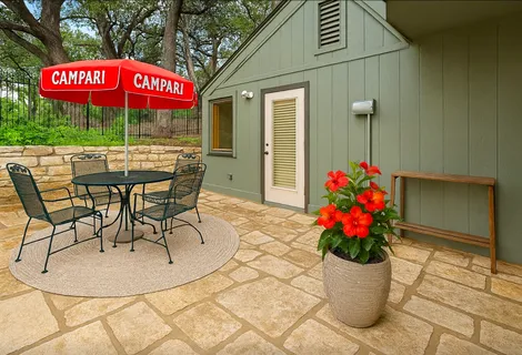 a view of a balcony with a floor to ceiling window and wooden floor