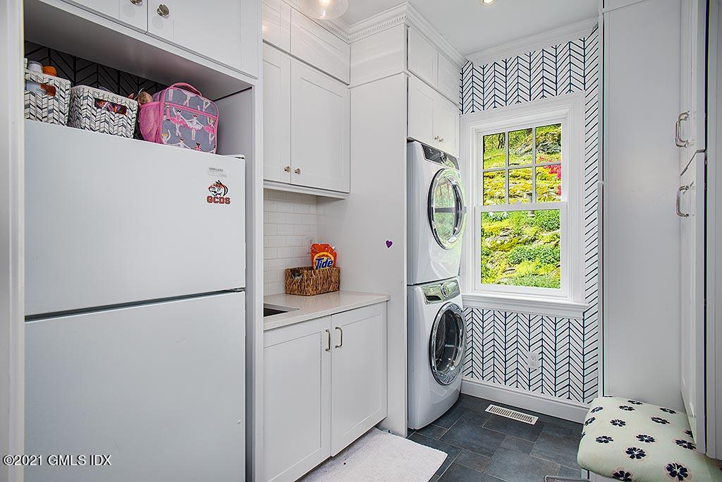 2 Carriage Road Cos Cob, CT 06807 - Photo 11 of 25 a kitchen with a refrigerator and a window
