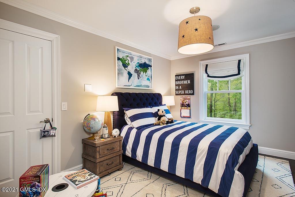 2 Carriage Road Cos Cob, CT 06807 - Photo 15 of 25 a bedroom with a bed and a window