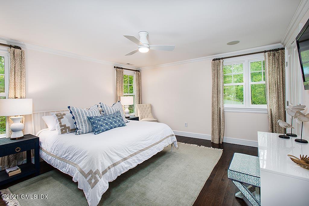2 Carriage Road Cos Cob, CT 06807 - Photo 16 of 25 a bedroom with a bed and a large window