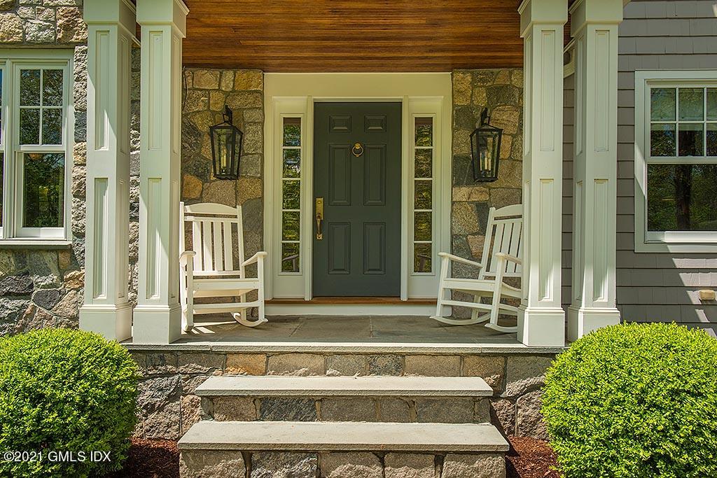2 Carriage Road Cos Cob, CT 06807 - Photo 2 of 25 front view of a house with a large window