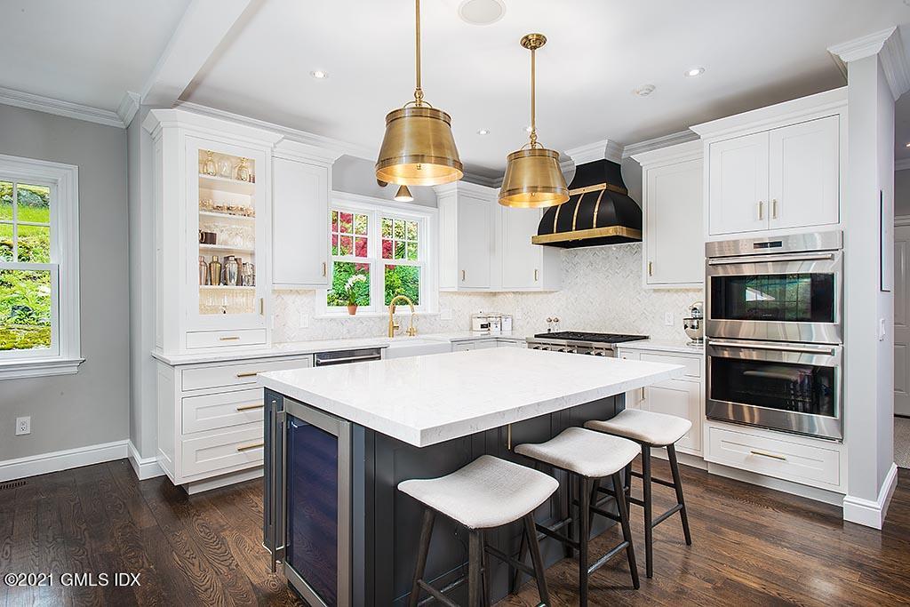 2 Carriage Road Cos Cob, CT 06807 - Photo 5 of 25 a kitchen with a table and chairs in it