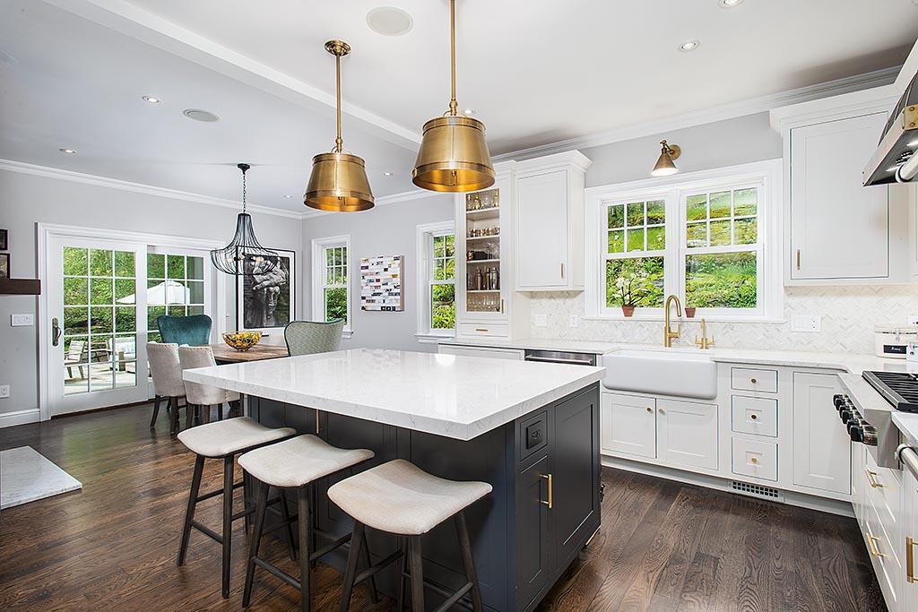 2 Carriage Road Cos Cob, CT 06807 - Photo 6 of 25 a open kitchen with stainless steel appliances granite countertop a stove a sink a microwave a dining table and chairs with wooden floor