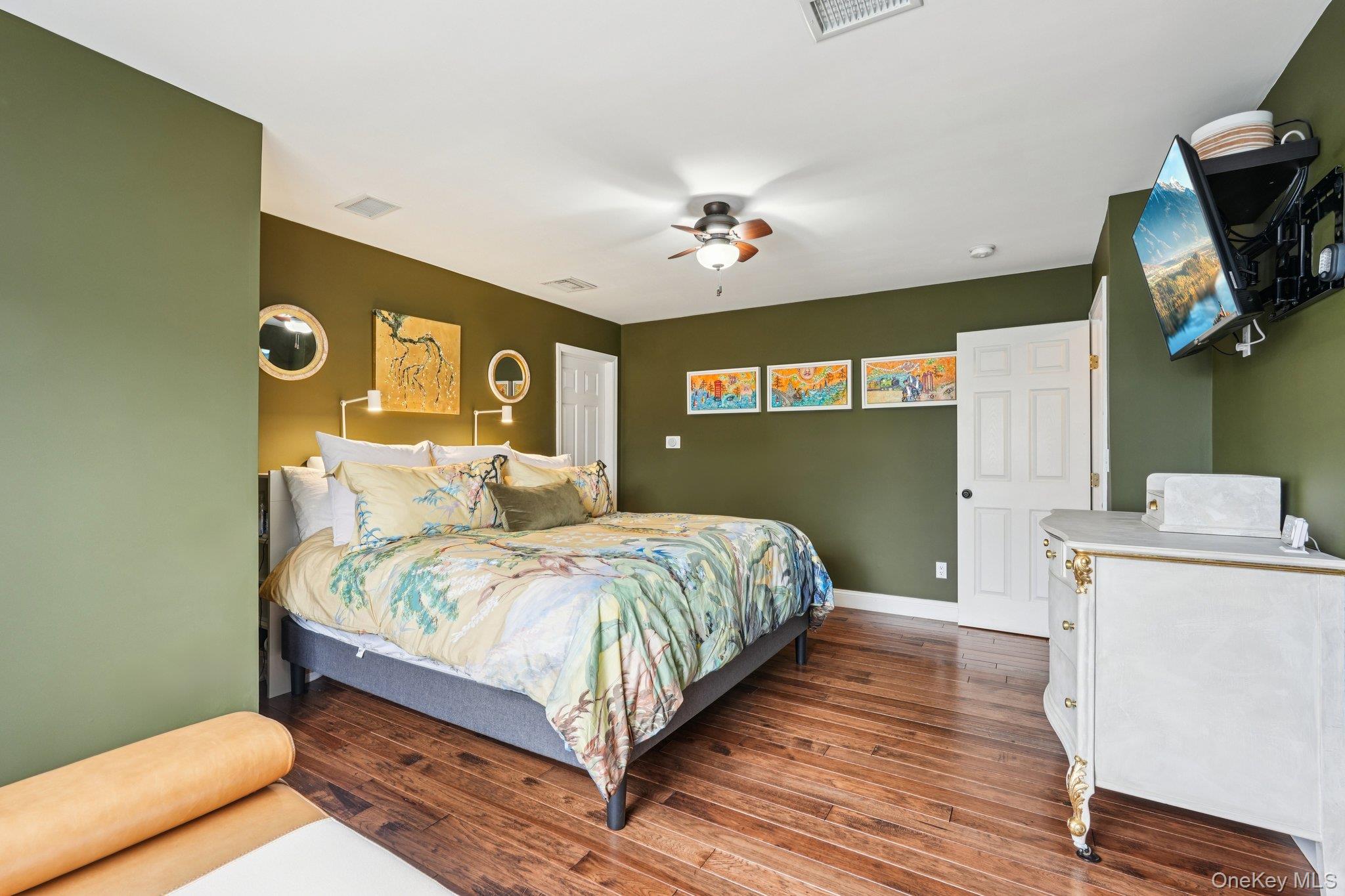 55 Buckberg Road Tomkins Cove, NY 10986 - Photo 14 of 46 a bedroom with a bed and a chandelier