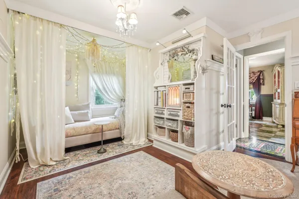 a living room with furniture windows and a table
