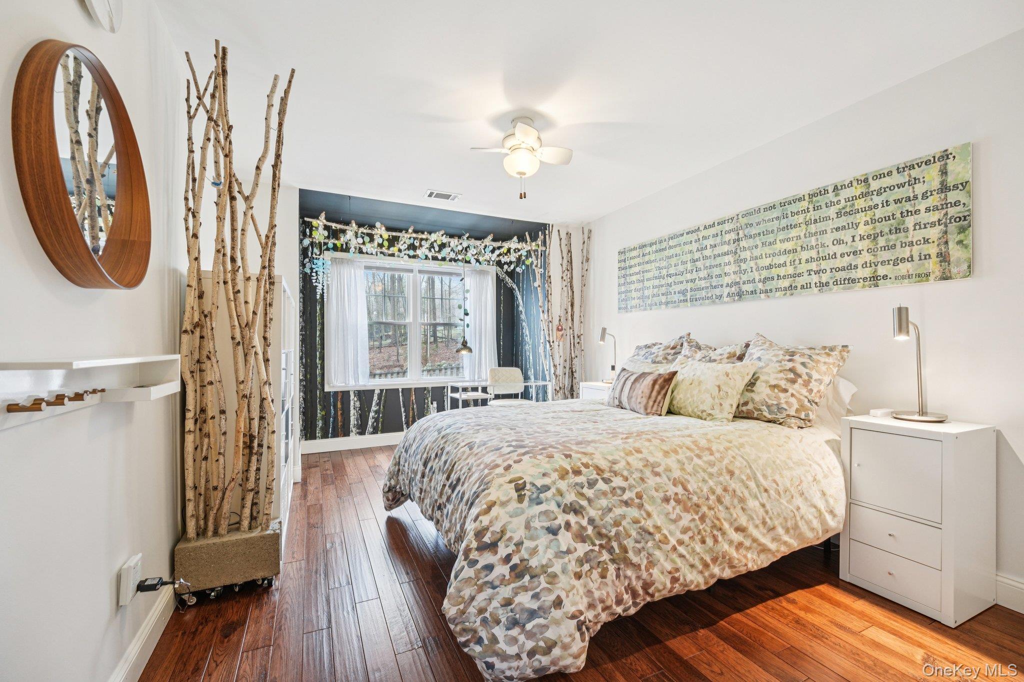55 Buckberg Road Tomkins Cove, NY 10986 - Photo 18 of 46 a bedroom with a bed and a chandelier