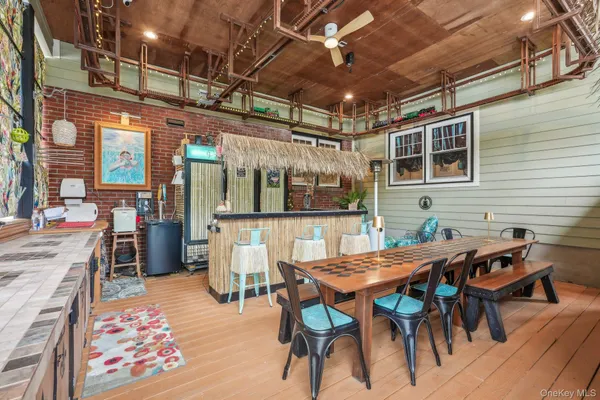 a view of a dinning table and chairs in the patio