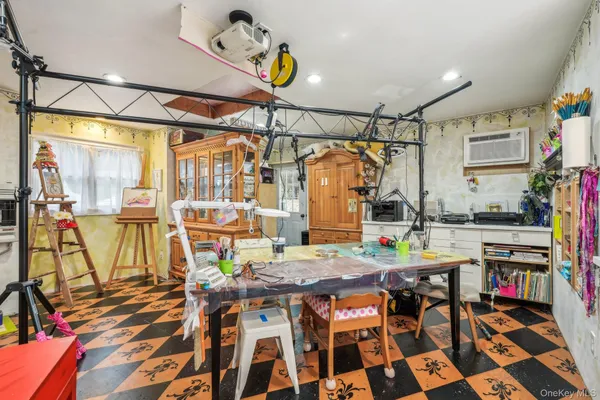 a view of dinning table and chairs in a room