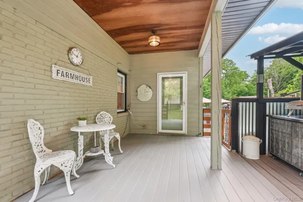 a view of a chairs and table in a patio