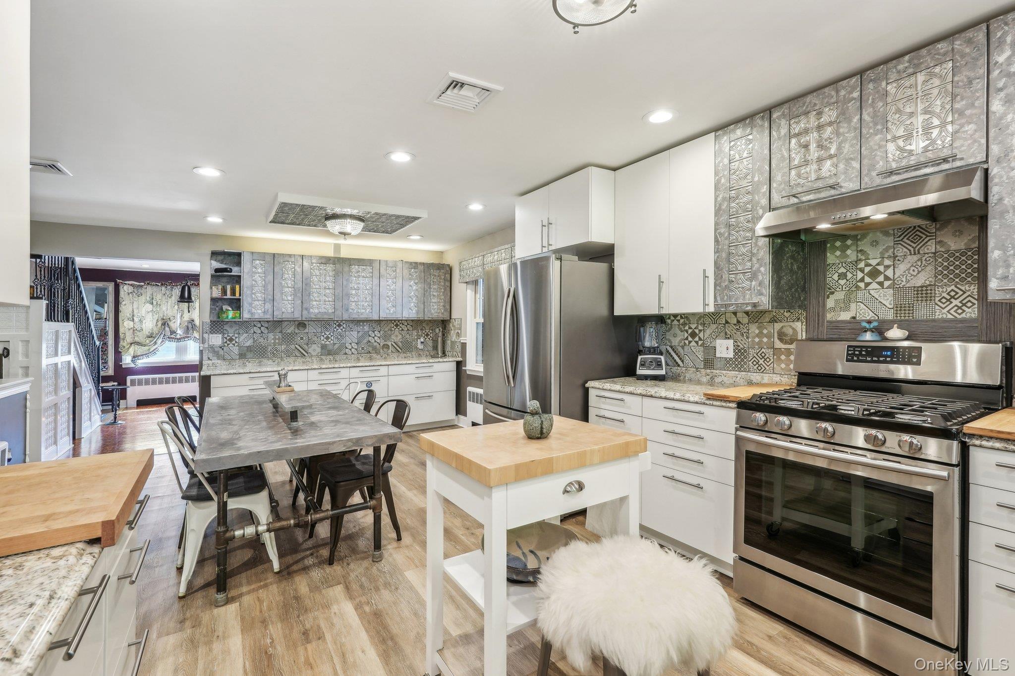 55 Buckberg Road Tomkins Cove, NY 10986 - Photo 3 of 46 a kitchen with a stove a refrigerator and a dining table