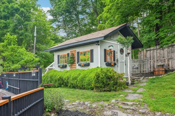 a view of a house with a yard and plants