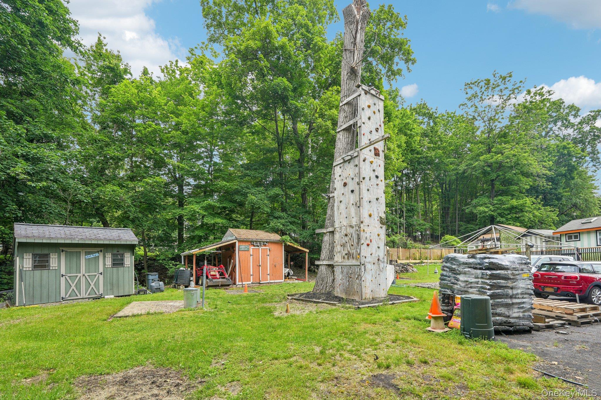 55 Buckberg Road Tomkins Cove, NY 10986 - Photo 40 of 46 a view of a house with backyard and a tree