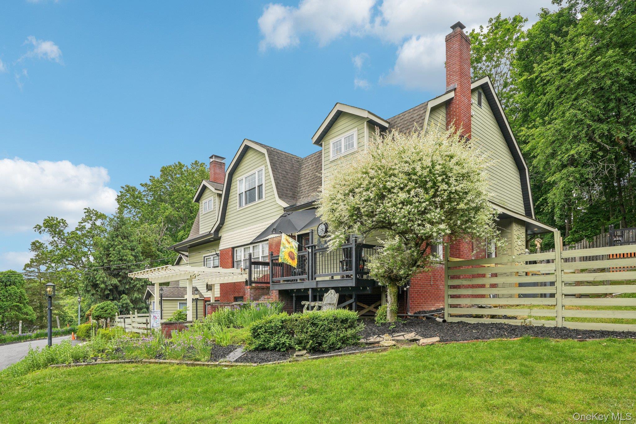 55 Buckberg Road Tomkins Cove, NY 10986 - Photo 43 of 46 a front view of a house with a yard and trees