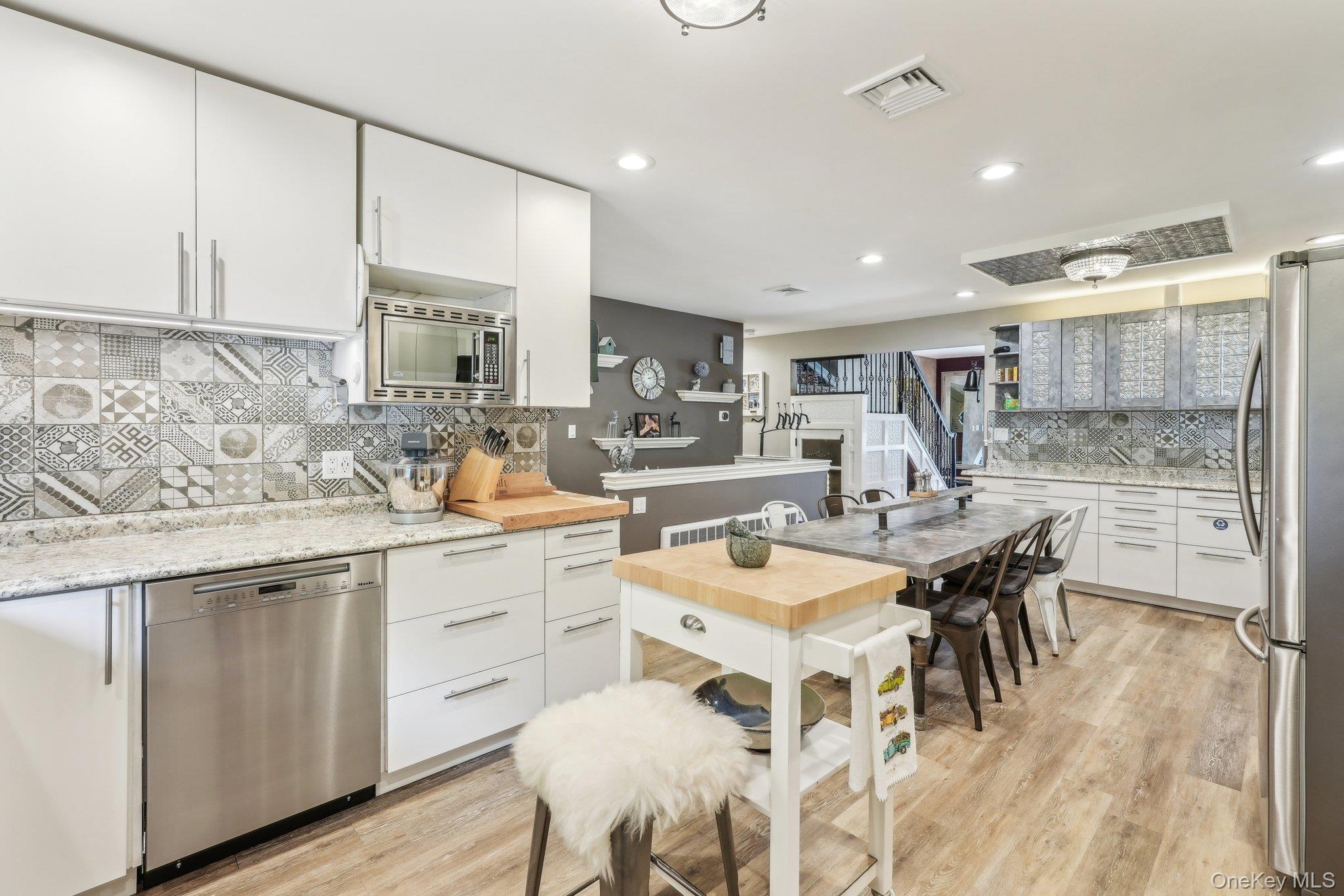 55 Buckberg Road Tomkins Cove, NY 10986 - Photo 5 of 46 a kitchen with a dining table chairs sink and cabinets