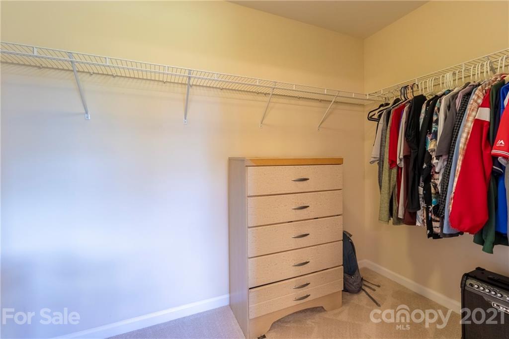 13010 Hill Pine Road Midland, NC 28107 - Photo 22 of 32 a view of walk in closet with clothes