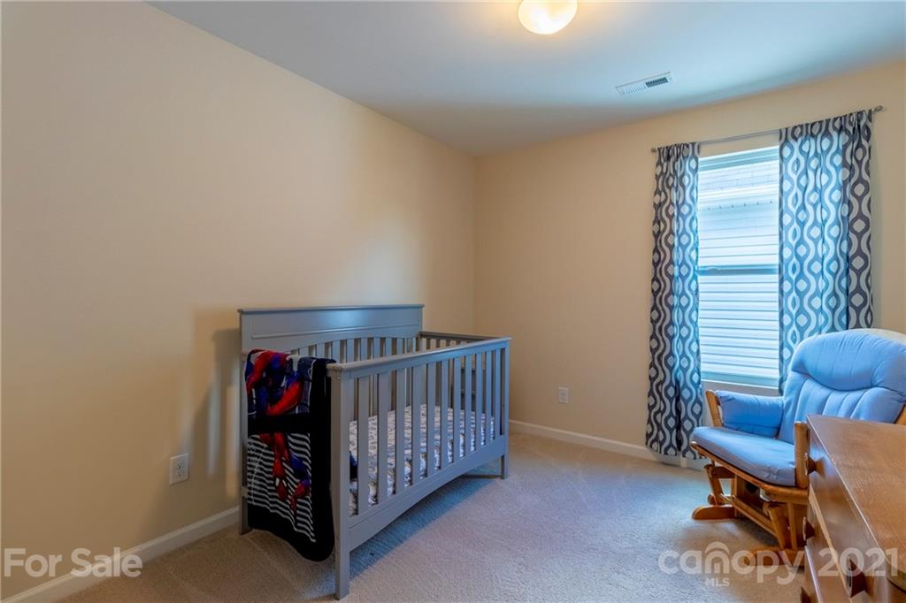 13010 Hill Pine Road Midland, NC 28107 - Photo 25 of 32 a bedroom with furniture and a window
