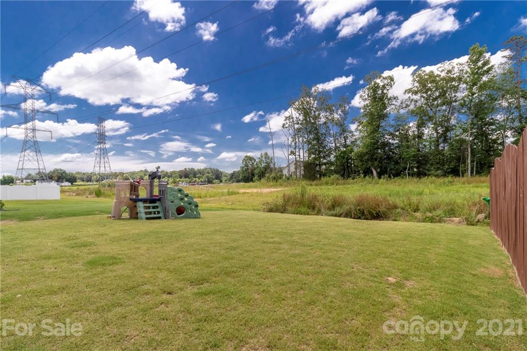 13010 Hill Pine Road Midland, NC 28107 - Photo 29 of 32 a view of a lake with houses in the background
