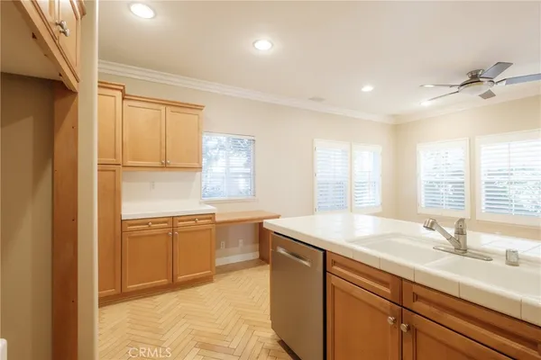 a kitchen with sink refrigerator and window