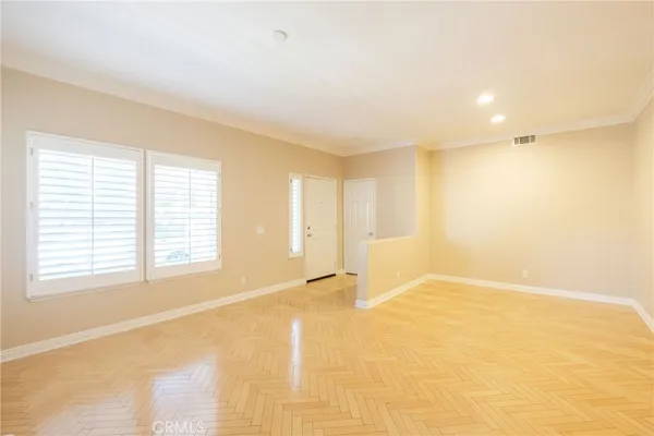 a view of an empty room with a window