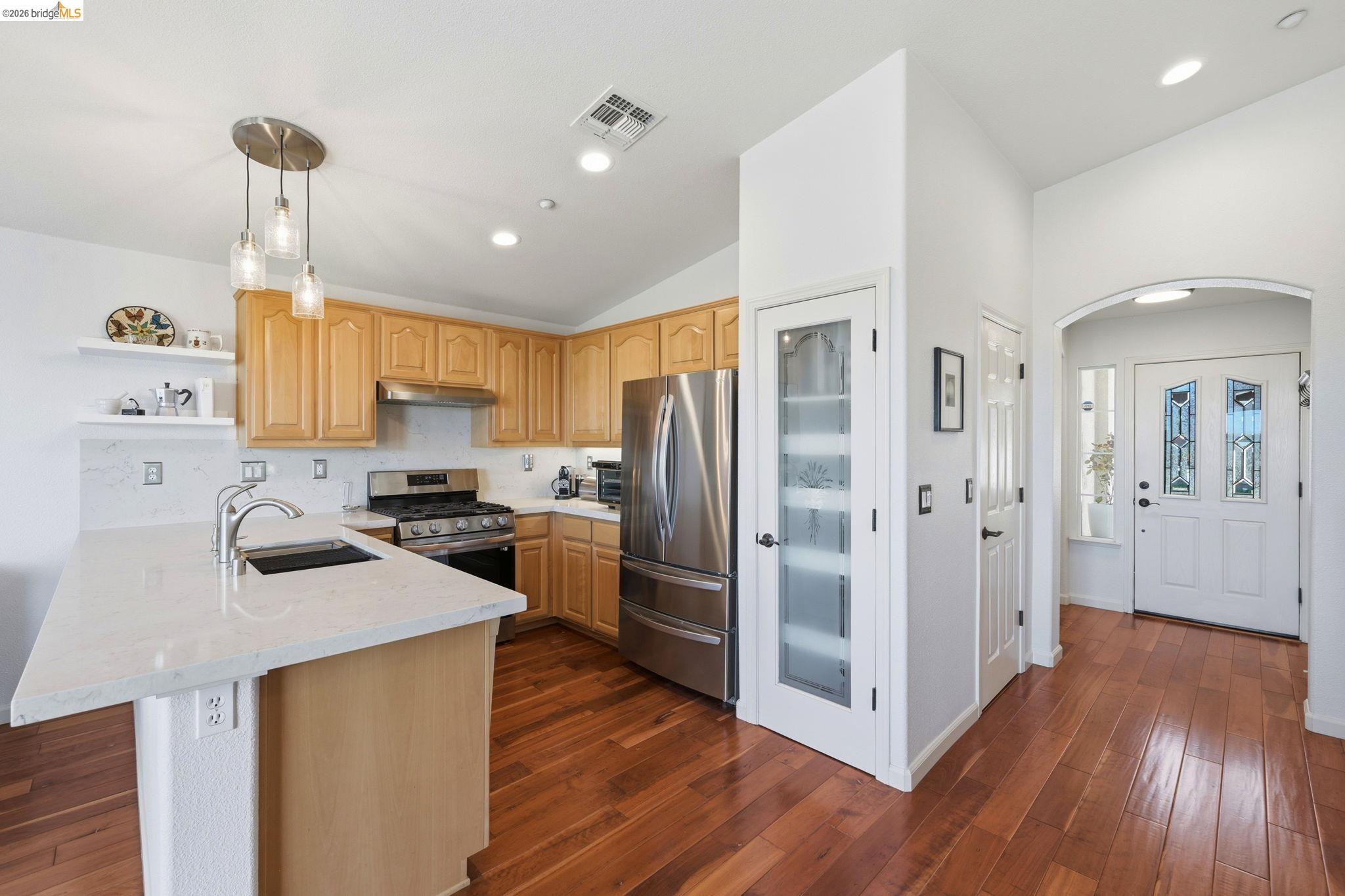 1024 Diamante Rio Vista, CA 94571 - Photo 12 of 27 Kitchen featuring light wood cabinetry, stainless steel appliances, a gas range, and light-toned countertops