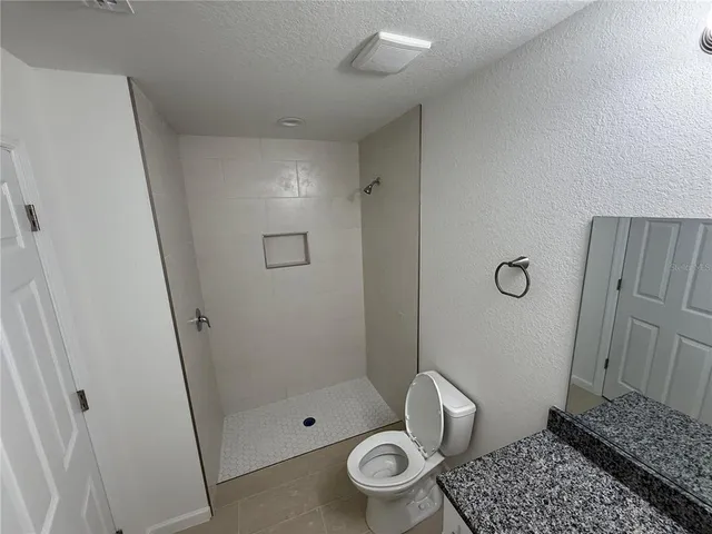 a bathroom with a sink and shower