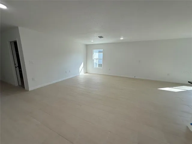 a view of storage and utility room with racks on the wall
