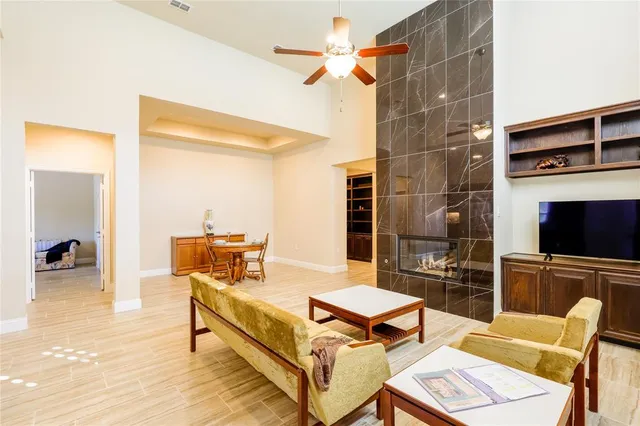 a living room with furniture a rug and a flat screen tv