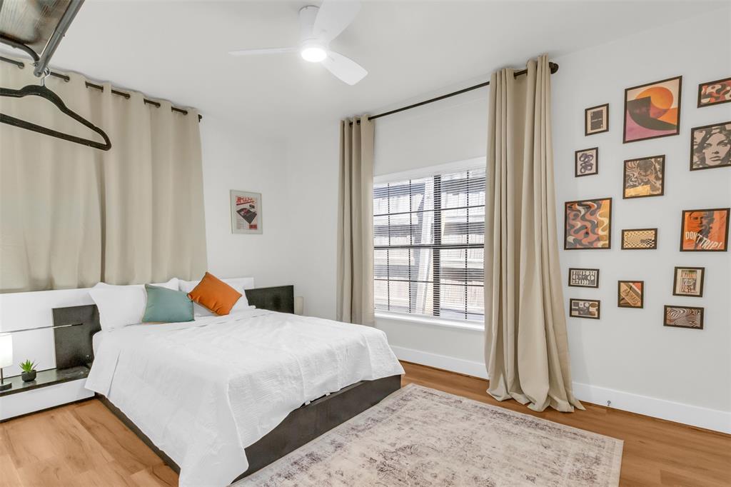 4121 Junius Street, Unit 4123 Dallas, TX 75246 - Photo 18 of 23 a bedroom with bed and a window