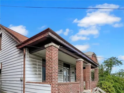 a view of a house with a roof deck