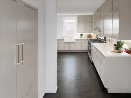 a kitchen with a sink a counter top space and cabinets