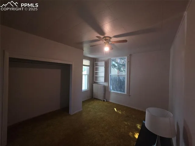 a view of livingroom with furniture and chandelier fan